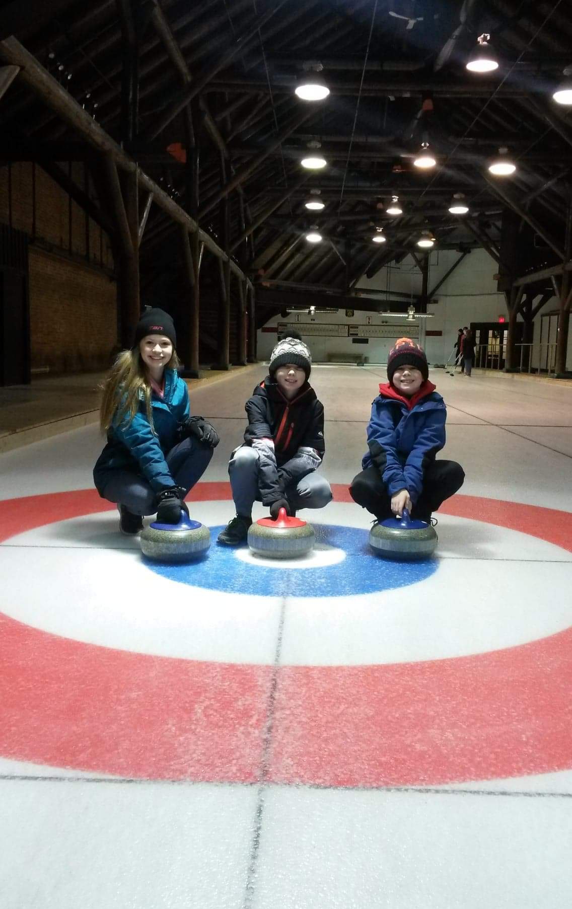 Curling party real game with three curlers
