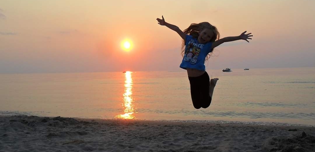 jumping at the beach photo