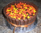 kit kat cake topped with reese's pieces candy