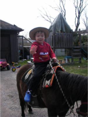 kid riding a horse